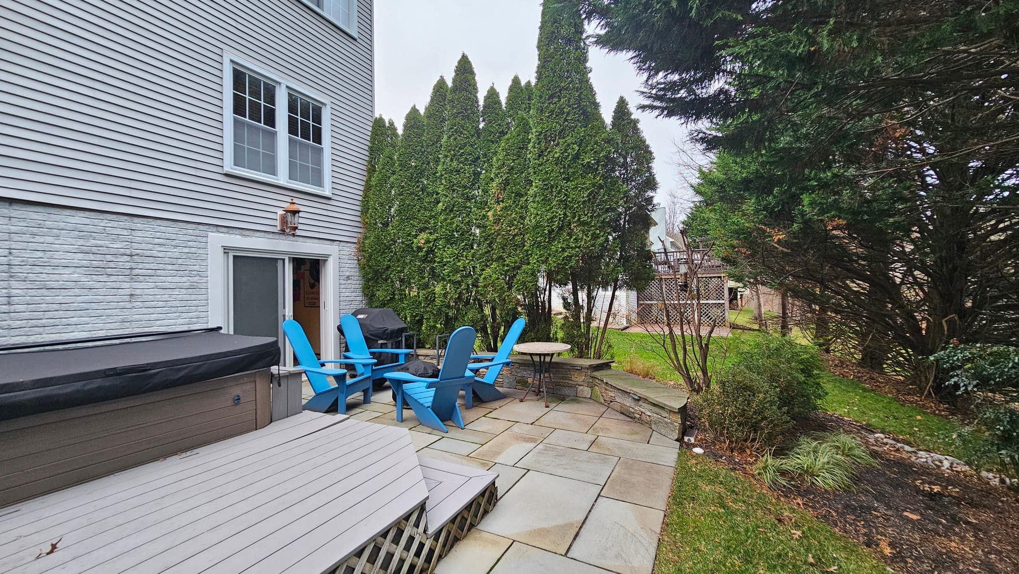 Project Wildfire construction field photo 01, documenting the outdoor fireplace, patio, lounge, and upper deck build