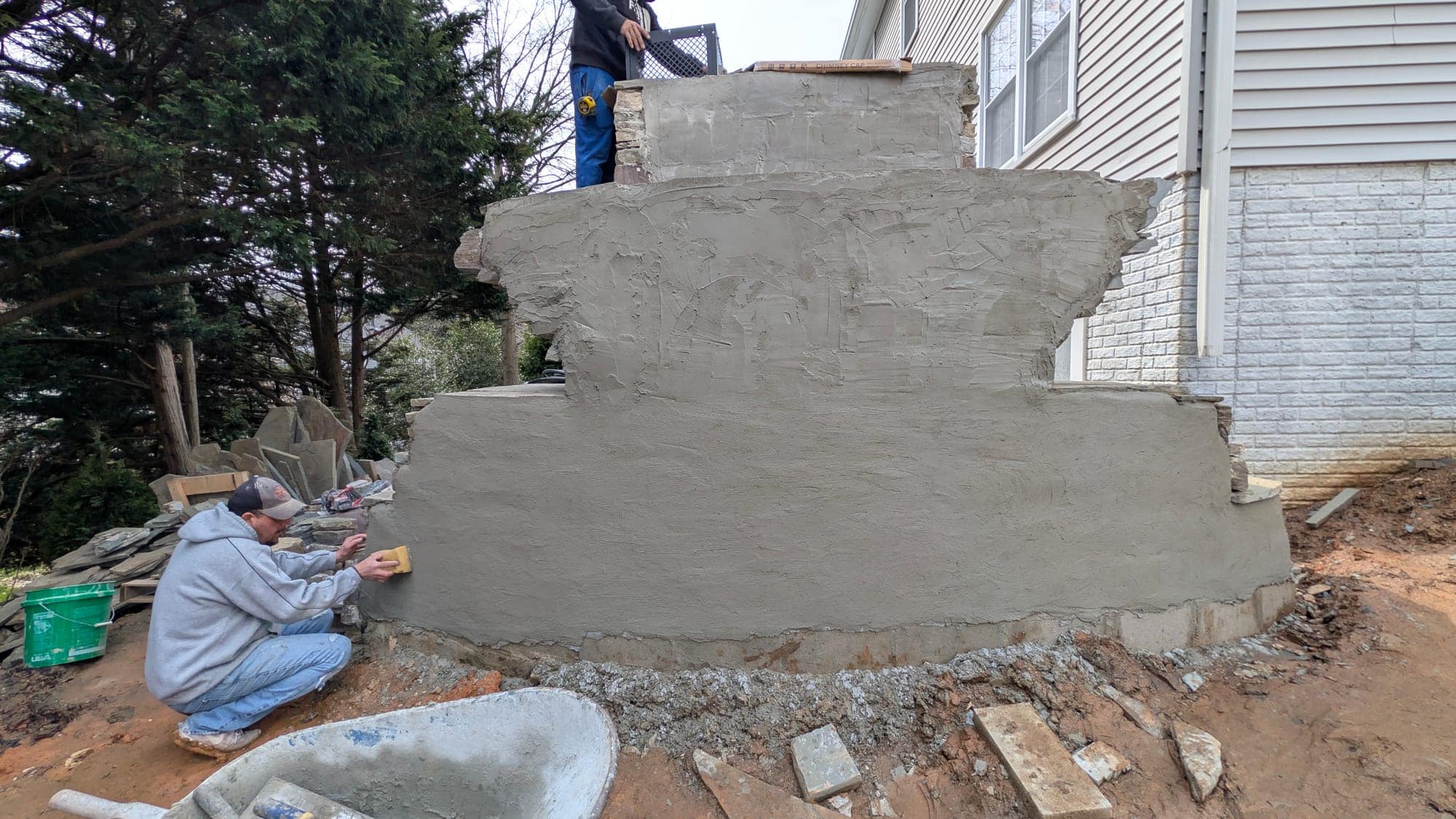 Project Wildfire construction field photo 41, documenting the outdoor fireplace, patio, lounge, and upper deck build