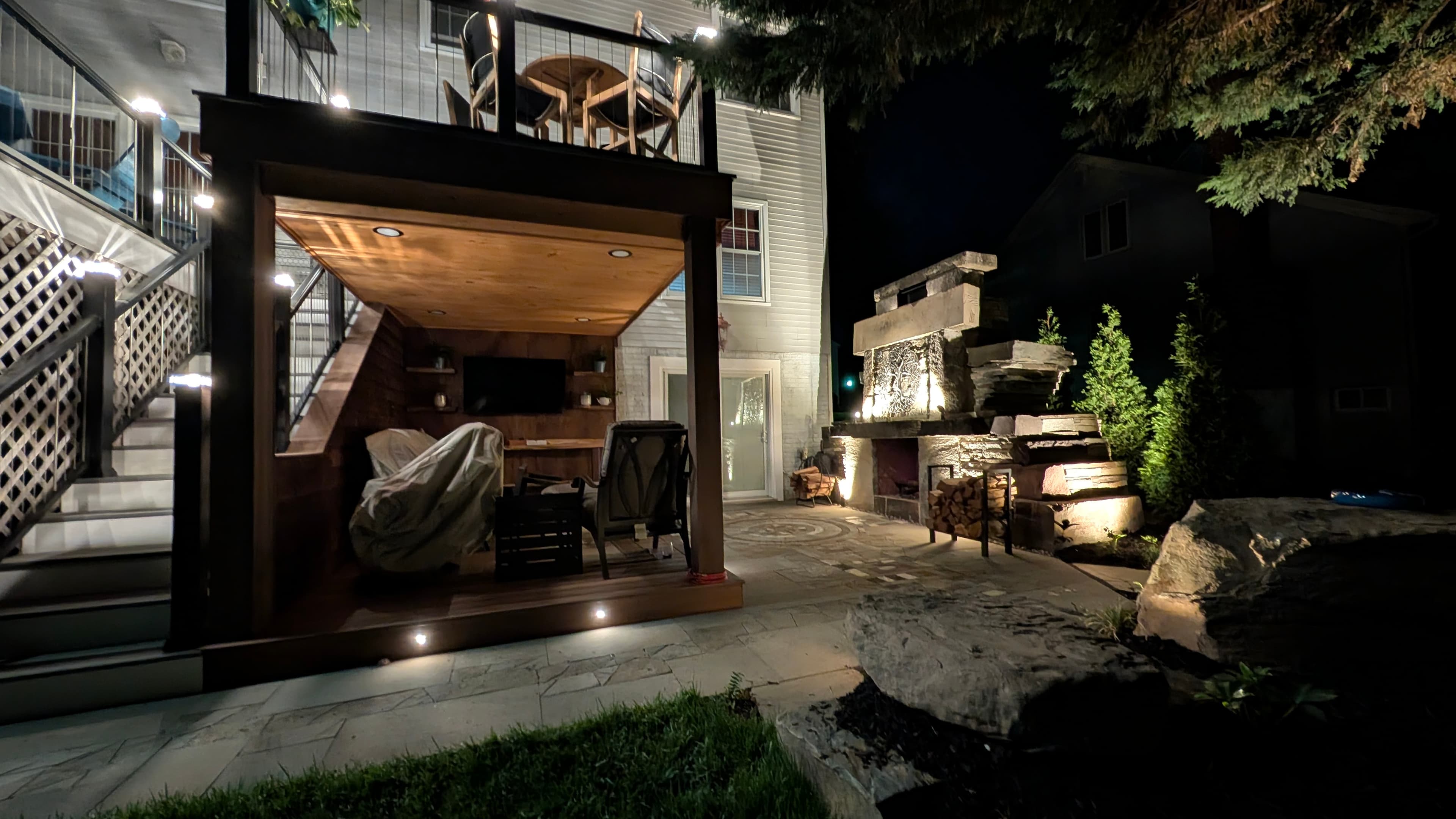 Project Wildfire rooftop lounge and outdoor fireplace at night